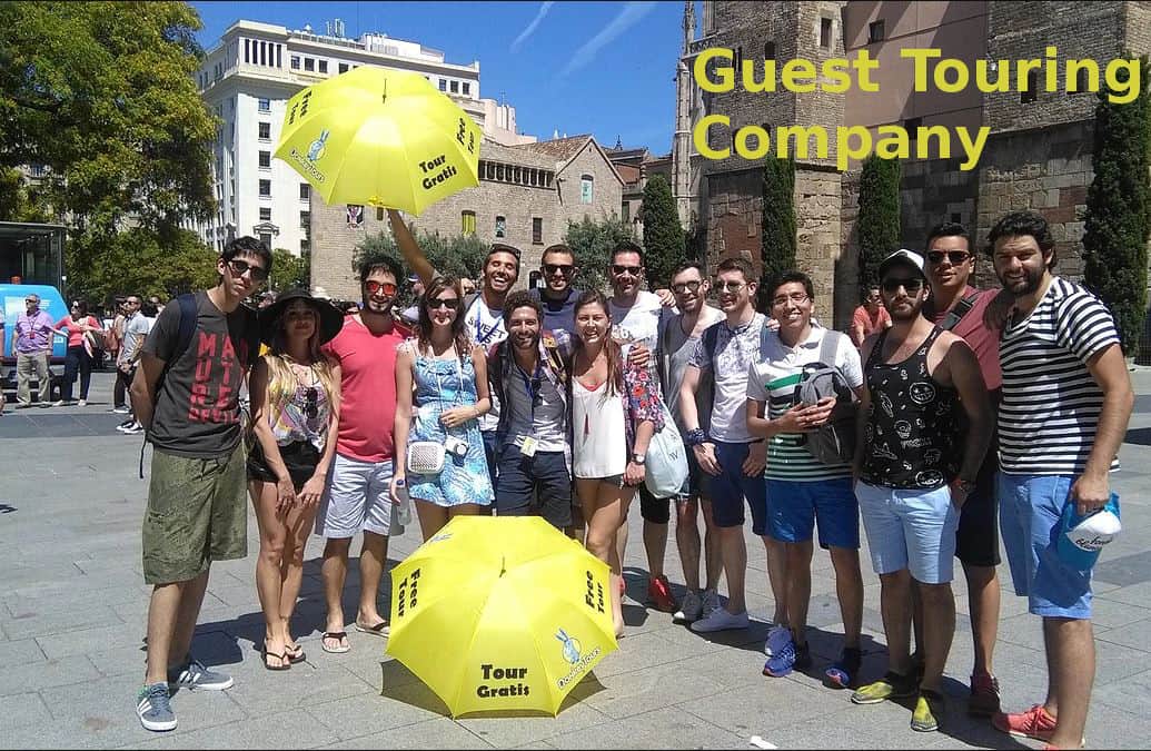 People pose for photographs in the blazing sun.