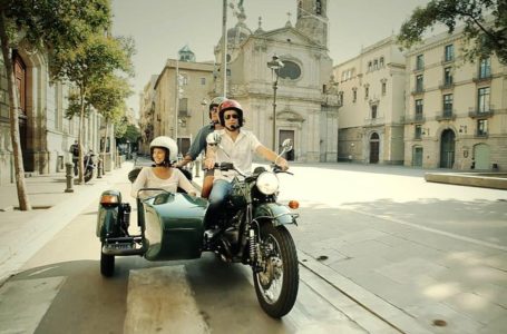 Photograph of people cruising in a sidecar
