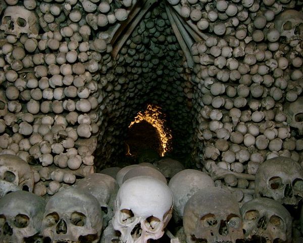 Skulls and other bones stacked inside the Sedlec Ossuary aka the 