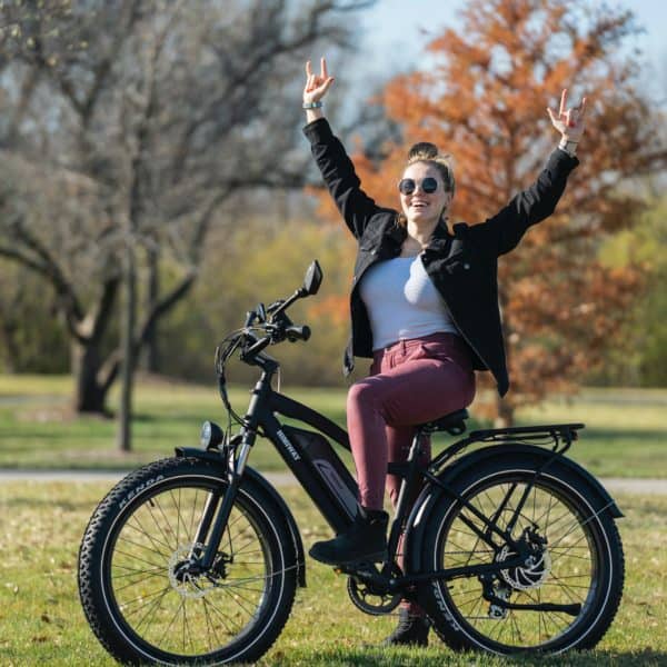 Girl posing for a photo on a bike