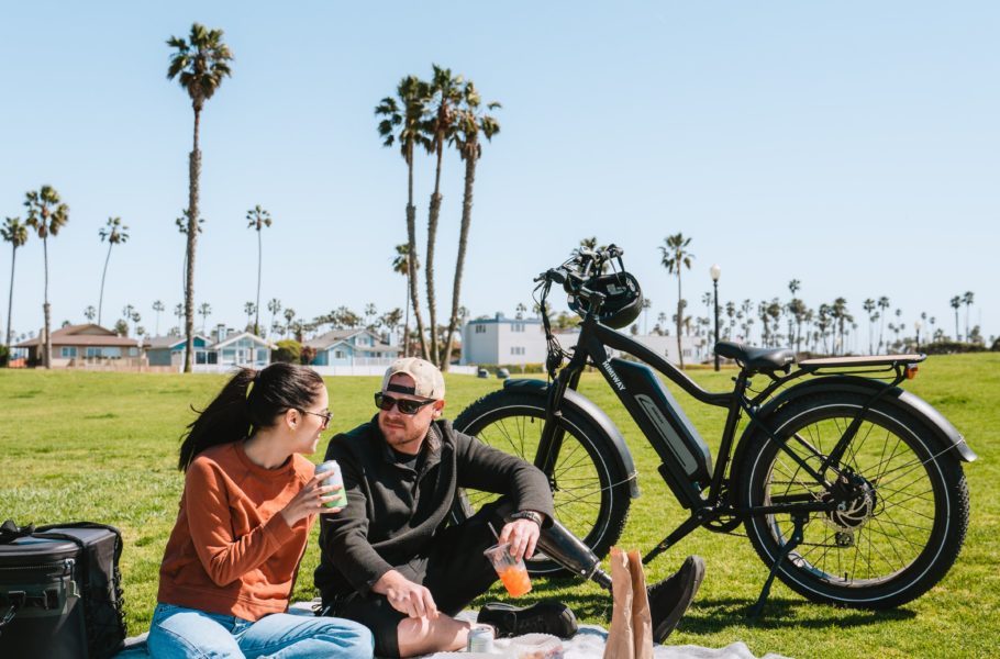 a couple enjoying a picnic by Himiway Bikes - Unsplash