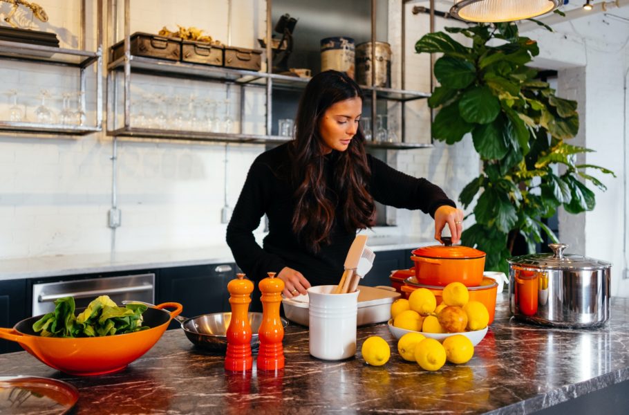 A woman in the kitchen by Jason Briscoe - Unsplash