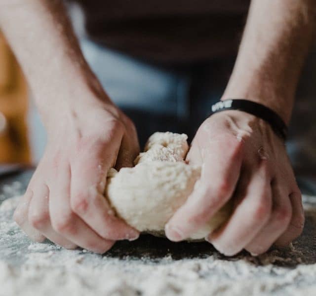 Person kneading flour