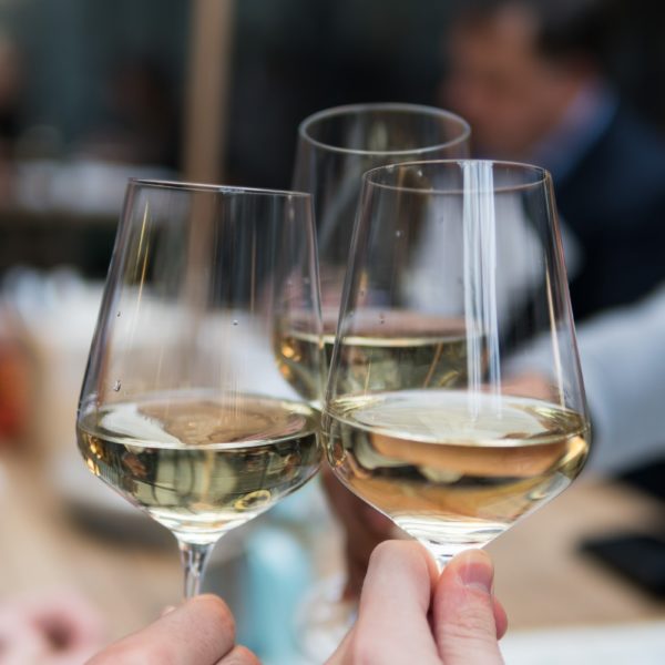 Celebrating with white wine by Matthieu Joannon - Unsplash
