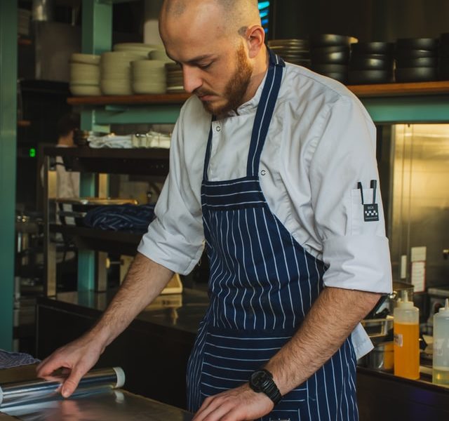 Man rolling out aluminium paper