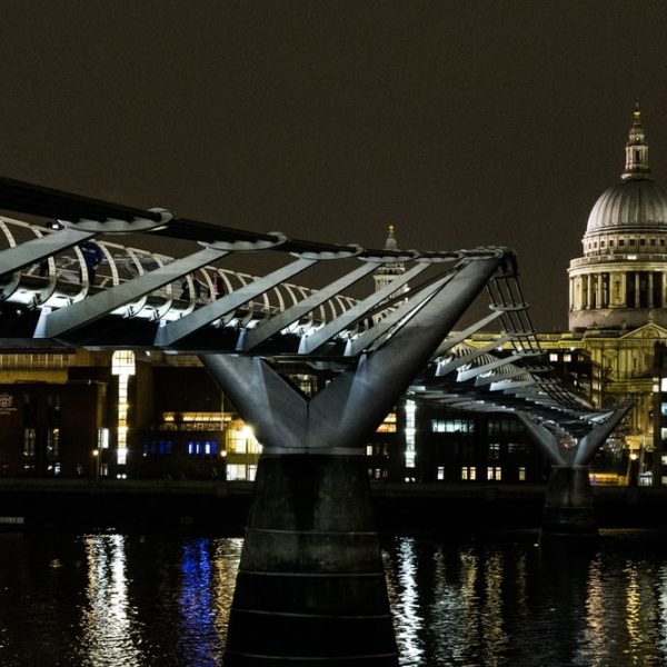 Millennium Bridge at night with St. Paul's at the background